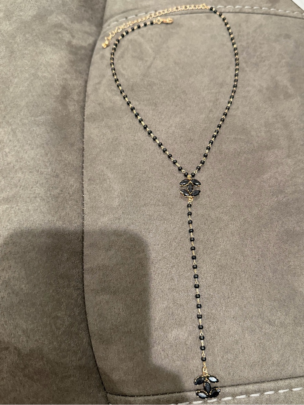 Others Follow Black and Gold Y-Drop Necklace with Floral Accents